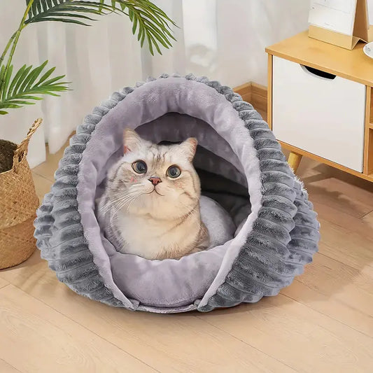Cozy conch shell-shaped cat bed with plush gray cushion