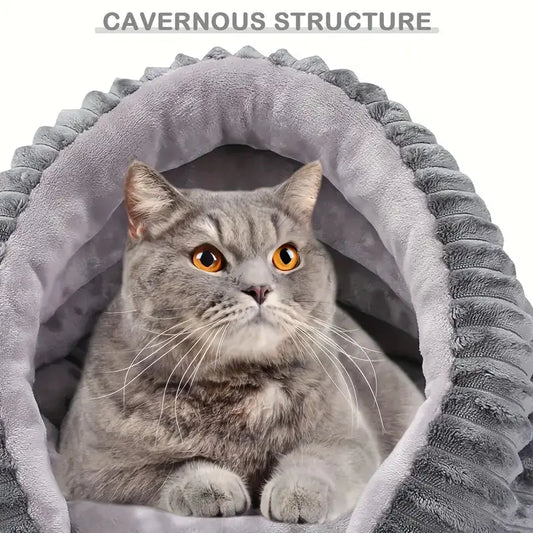 Indoor cat resting in plush conch shell pet cave